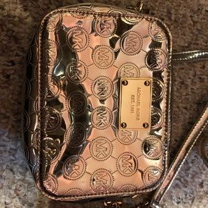 Michael Kors Gold Small Going Out Bag.